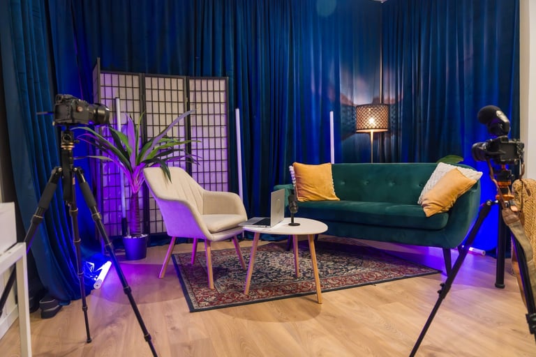 Creator recording and production studio setup with professional camera, microphone and laptop for livestreaming and video production